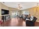Spacious living room with hardwood floors and sliding glass doors to the patio at 12925 Fieldmoor Ct, Riverview, FL 33579