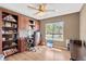 Comfortable office space with custom built-ins and a window showing green exterior at 12925 Fieldmoor Ct, Riverview, FL 33579