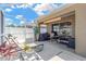 Back patio with lounge chairs, a dining table, grill, and a clear sky for outdoor enjoyment at 12925 Fieldmoor Ct, Riverview, FL 33579
