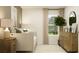 This modern bedroom features a daybed, sleek wood dresser, and natural light at 13518 White Gold Run, Parrish, FL 34219