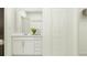 Clean bathroom with modern vanity, ample storage, and a well-lit mirror at 14984 Topaz Blue St, Wimauma, FL 33598