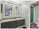 Bathroom features a double sink vanity, granite countertops, and a decorative backsplash at 16076 Dawnview Dr, Tampa, FL 33624
