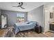 Bedroom with wood floor, ceiling fan and view of the outside at 16076 Dawnview Dr, Tampa, FL 33624