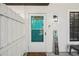 View of the home's front door, featuring a welcome sign at 16076 Dawnview Dr, Tampa, FL 33624