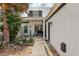 View of the home's front porch, featuring a welcome sign and a bench at 16076 Dawnview Dr, Tampa, FL 33624