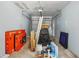 Cluttered garage ready for a new owner to transform into a functional space at 16076 Dawnview Dr, Tampa, FL 33624