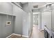 Hallway with laundry hookups, overhead lighting, and doorway leading to other rooms at 16076 Dawnview Dr, Tampa, FL 33624