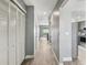 Hallway with wood floors and access to kitchen at 16076 Dawnview Dr, Tampa, FL 33624
