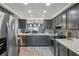 Well-lit kitchen with stainless steel appliances, granite countertops, and stylish backsplash at 16076 Dawnview Dr, Tampa, FL 33624