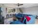 Living room featuring a large sectional sofa and open access to the kitchen at 16076 Dawnview Dr, Tampa, FL 33624