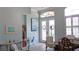 Inviting foyer with natural light, tiled floor, decorative wreaths, and an open floor plan at 16515 Nikki Ln, Odessa, FL 33556