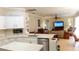Open-concept kitchen with island seamlessly flowing into the living room, perfect for entertaining at 16515 Nikki Ln, Odessa, FL 33556