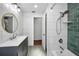 Updated bathroom featuring a shower/tub combo and a stylish vanity at 1766 Hitching Post Ln, Dunedin, FL 34698
