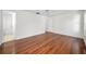 Spacious bedroom with gleaming hardwood floors and natural light at 1766 Hitching Post Ln, Dunedin, FL 34698