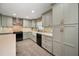 Well-equipped kitchen with neutral cabinets, and granite counters, stainless appliances, and stylish accents at 1766 Hitching Post Ln, Dunedin, FL 34698
