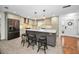 Spacious kitchen with an island, modern cabinets, stainless steel appliances, and stylish lighting at 1766 Hitching Post Ln, Dunedin, FL 34698