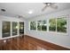 Sunroom with sliding glass doors and large windows overlooking the outdoor scenery at 1766 Hitching Post Ln, Dunedin, FL 34698