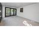 Enclosed patio with sliding glass doors, great for enjoying the outdoors year-round at 1766 Hitching Post Ln, Dunedin, FL 34698
