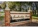 Entrance to Amberlea Park in the City of Dunedin with brick sign at 1766 Hitching Post Ln, Dunedin, FL 34698