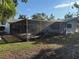 A screened in patio with lush landscaping is the focal point of this backyard at 1775 62Nd S Ter, St Petersburg, FL 33712