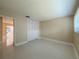 Bedroom view with a large closet, window with blinds, and doorway looking into the living area at 1775 62Nd S Ter, St Petersburg, FL 33712