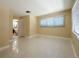 A bedroom leading to a bathroom, featuring windows and great natural light at 1775 62Nd S Ter, St Petersburg, FL 33712