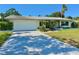 Charming one-story home with a two-car garage, mature landscaping, and a beautiful, tiled roof at 1775 62Nd S Ter, St Petersburg, FL 33712