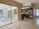 Open concept kitchen featuring stainless steel appliances, wood cabinets, and adjacent bar area at 1775 62Nd S Ter, St Petersburg, FL 33712