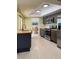 Well-lit kitchen featuring stainless steel appliances and modern cabinetry at 1775 62Nd S Ter, St Petersburg, FL 33712