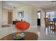 Bright living room featuring modern decor and a view into the dining area and the kitchen at 1775 62Nd S Ter, St Petersburg, FL 33712