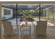 Relaxing screened-in patio featuring comfortable seating and garden views at 1775 62Nd S Ter, St Petersburg, FL 33712