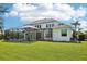 Expansive backyard featuring a screened-in patio area perfect for outdoor relaxation at 19803 Prince Benjamin Dr, Lutz, FL 33549