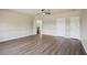 Bedroom featuring neutral walls, wood flooring, and open doorways at 19803 Prince Benjamin Dr, Lutz, FL 33549