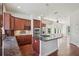 Gourmet kitchen featuring granite countertops, a stylish island, stainless steel appliances, and hardwood floors at 19803 Prince Benjamin Dr, Lutz, FL 33549