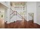 Spacious living room featuring hardwood floors and a grand staircase to the second floor at 19803 Prince Benjamin Dr, Lutz, FL 33549
