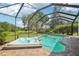 Beautiful in-ground pool with attached spa and screened enclosure that provides for a relaxing private oasis at 19803 Prince Benjamin Dr, Lutz, FL 33549