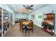 Community room features book shelves, a dining area, and comfortable lounge seating at 2212 Portside Psge, Palm Harbor, FL 34685