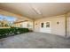 Welcoming covered entrance with double doors and manicured hedges provides a stately access point to the home at 2212 Portside Psge, Palm Harbor, FL 34685