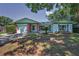 Inviting single-Gathering home with a well-maintained lawn, attached garage, and charming brick accents at 2212 Portside Psge, Palm Harbor, FL 34685