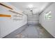 Spacious garage with ample storage shelves and an automatic door at 2212 Portside Psge, Palm Harbor, FL 34685
