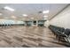 Large meeting room featuring wood-look floors, fireplace, and rows of chairs at 2212 Portside Psge, Palm Harbor, FL 34685