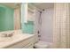Bright bathroom with a shower-tub combo, storage cabinet, and vanity at 255 114Th N Ave # 4, St Petersburg, FL 33716