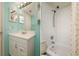 Bathroom featuring vanity with storage, shower-tub combo, and mirrored cabinets at 255 114Th N Ave # 4, St Petersburg, FL 33716