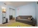 This ' room features a sofa, a mirror closet, and a unique soccer field rug at 255 114Th N Ave # 4, St Petersburg, FL 33716