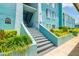 Stairwell leading up to a three story condo in a tropical environment at 255 114Th N Ave # 4, St Petersburg, FL 33716