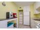 The kitchen features modern appliances and cabinets, as well as a rolling storage cart at 255 114Th N Ave # 4, St Petersburg, FL 33716