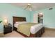 Spacious main bedroom featuring a storage bed, side table, and access to a closet at 255 114Th N Ave # 4, St Petersburg, FL 33716