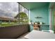 Enclosed patio with seating area, plants, and exterior view at 255 114Th N Ave # 4, St Petersburg, FL 33716