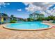 A spacious pool surrounded by chairs and tables to enjoy in the sunshine at 255 114Th N Ave # 4, St Petersburg, FL 33716