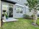 Inviting backyard with a concrete patio, lush lawn, and privacy fencing, perfect for outdoor enjoyment at 2717 Chestnut Creek Pl, Brandon, FL 33510